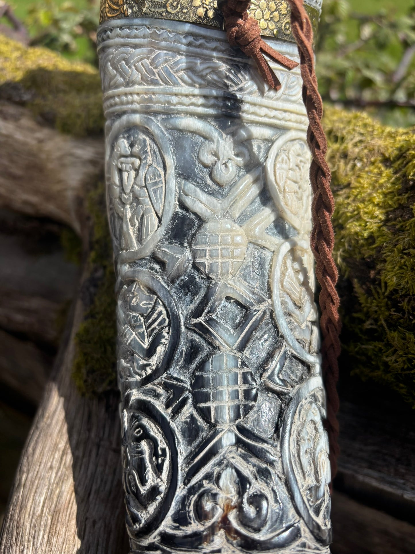 Intricate interlaced carving on Viking blowing horn, Oliphant replica
