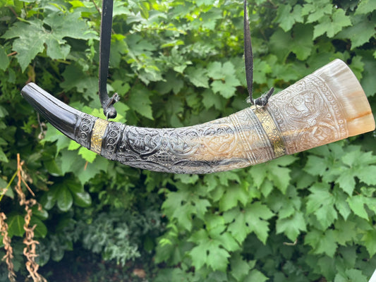 Viking blowing horn carved as a replica of the British Museum Oliphant, full length view
